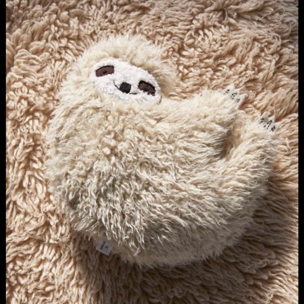 Urban outfitters furry sloth pillow